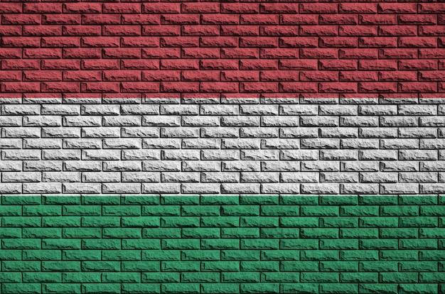 Hungary flag is painted onto an old brick wall