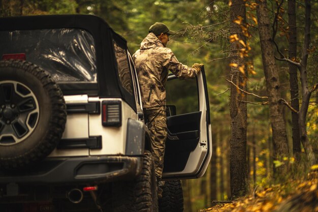 Hunter Taking a Look From All Wheels Drive Vehicle