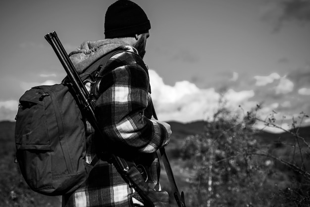 Hunter with shotgun gun on hunt