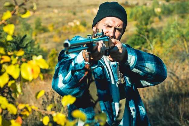 Hunter with shotgun gun on hunt.