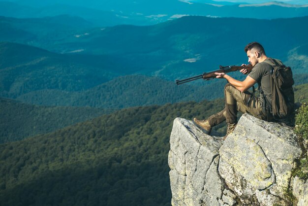 Hunter with a shotgun in a traditional shooting clothing Wildlife Hunting Hunting Gear  Hunting Supp