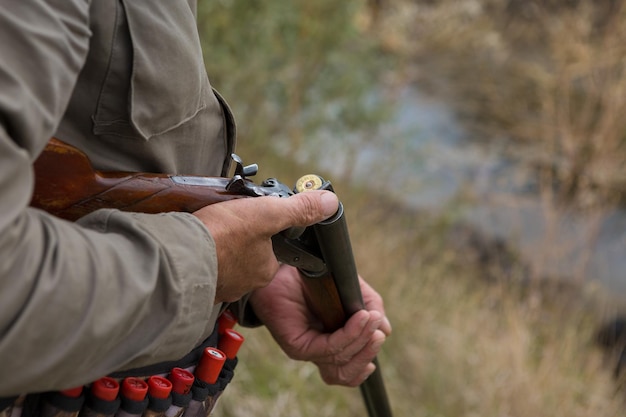 Hunters with a german drathaar and spaniel, pigeon hunting with dogs in reflective vests