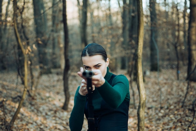 Hunting target. Target shot. female hunter in forest. woman with weapon. girl with rifle. chase hunting. Gun shop. successful hunt. hunting sport. military fashion. achievements of goals