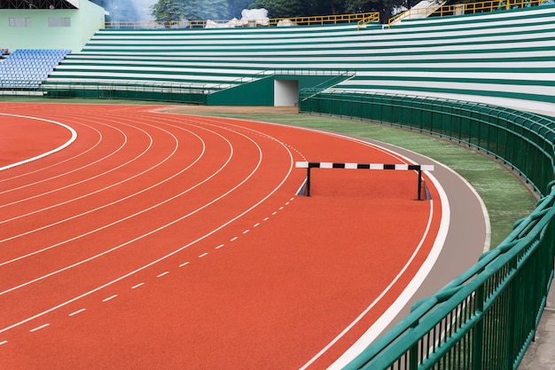 Photo hurdle on red running track