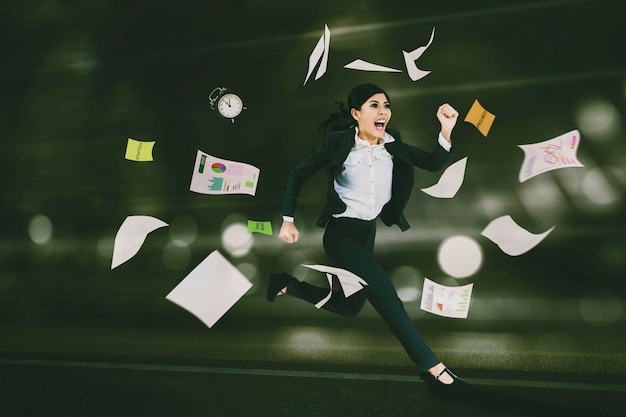 Hurry businesswoman running with flying paperwork