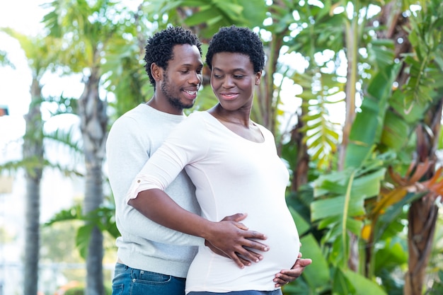 Husband embracing pregnant wife 