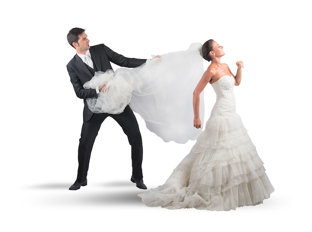 Husband grabbing Bridal veil of his wife