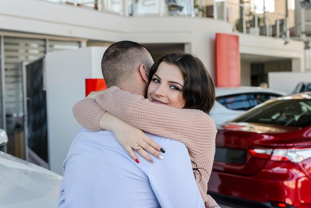 Husband making surprise to his wife in showroom