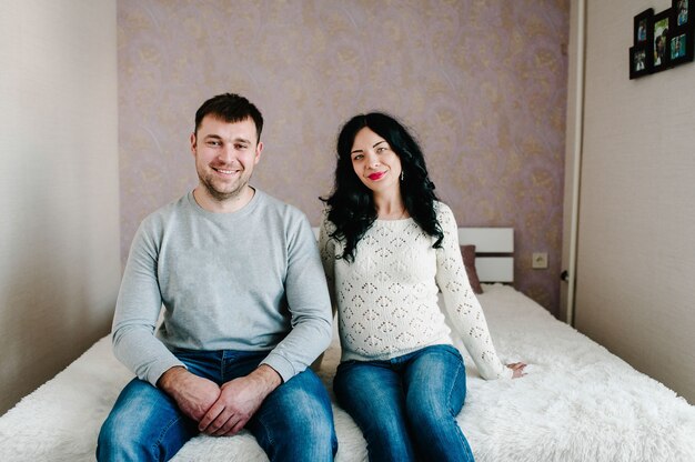 Husband and pregnant wife at home