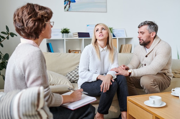 Husband trying to get along with wife at therapy session