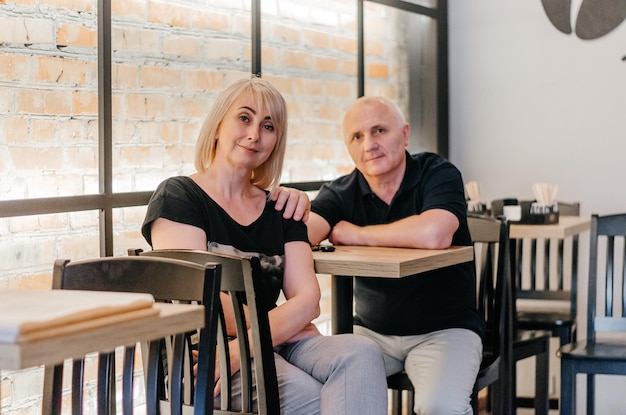 husband and wife are sitting at the table