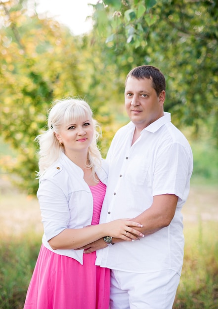 Husband and wife outdoors in summer