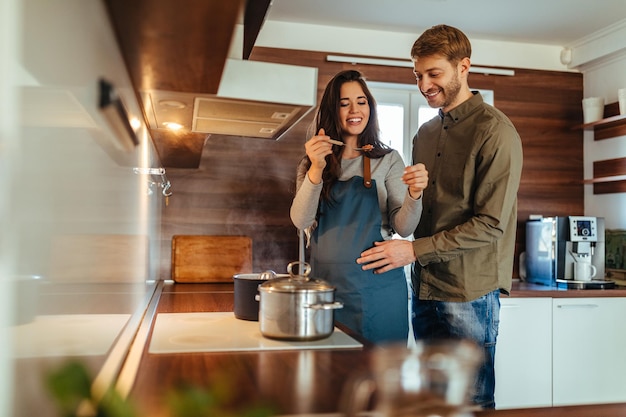 Husband and wife preparing lunch at home