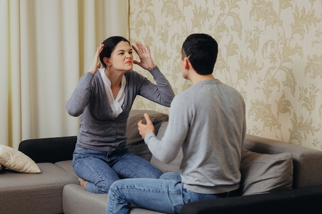 Husband and wife quarrel, shout at each other