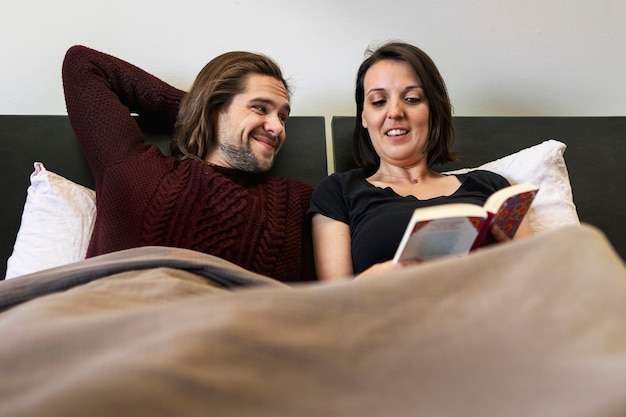 Husband and wife reading in the bed