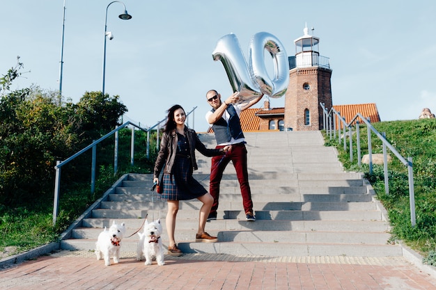 Photo husband and wife; together with two dogs