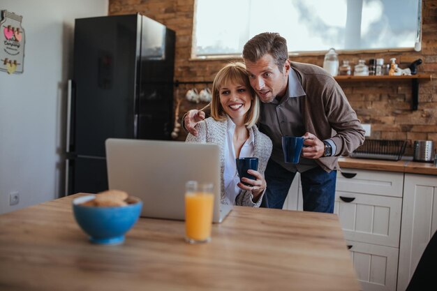 Husband and wife using online communication to talk with cousin