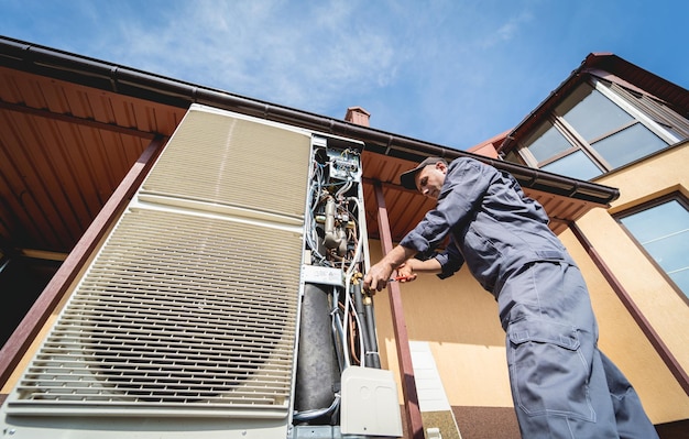 Hvac technician servicing home heating and cooling system