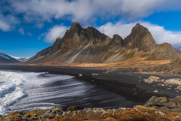 The Hvalnes peninsula with its mountain and black peeble beach situated in South Iceland near Hofn