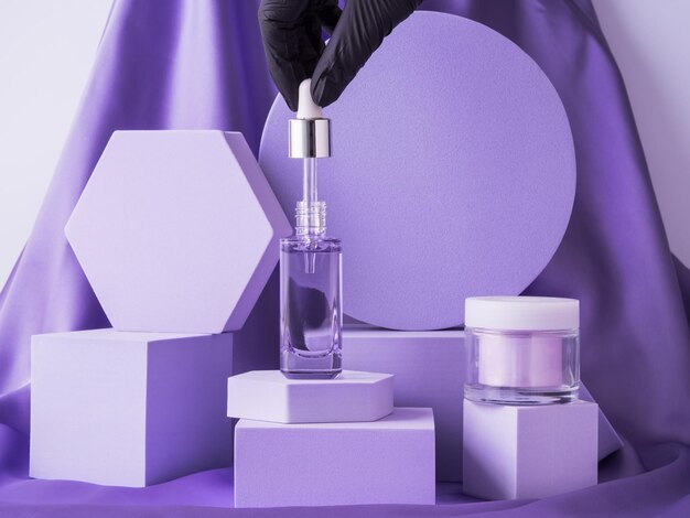 Hyaluronic acid serum bottle and anti aging cream on purple background displayed on geometric podium