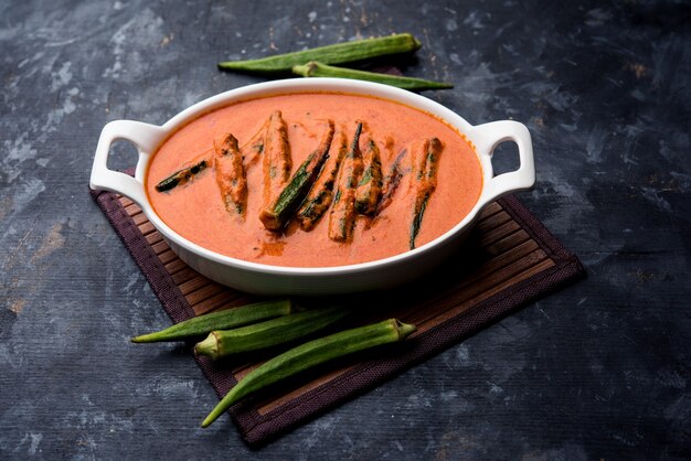 Hyderabadi Bhindi ka Salan or Okra salan made using ladies' fingers or ochro. Main course recipe from India. served in a bowl. selective focus