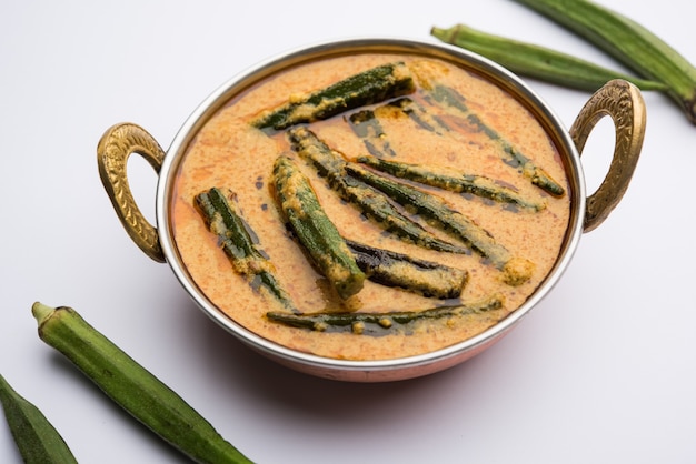 Hyderabadi Bhindi ka Salan or Okra salan made using ladies' fingers or ochro. Main course recipe from India. served in a bowl. selective focus