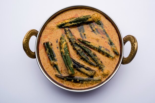 Hyderabadi bhindi ka salan or okra salan made using ladies' fingers or ochro. main course recipe from india. served in a bowl. selective focus