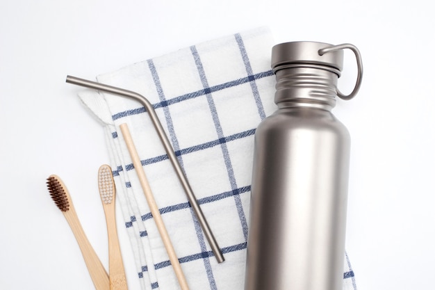 Hydration Bottle and reusable stainless steel straws with Bamboo toothbrushes. Zero waste concept.