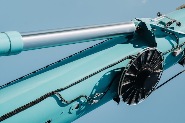 Hydraulic cylinder of the lifting system on a car crane.The control system of the crane engine.