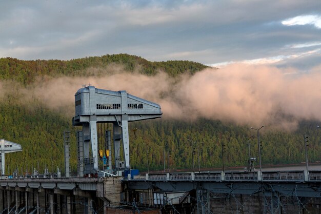 Hydroelectric power station on the river among the mountains Electricity production ecology climate change