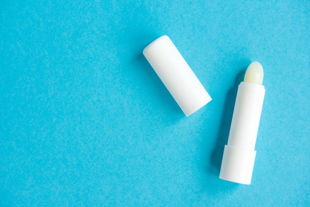 Hygiene lipstick isolated on blue