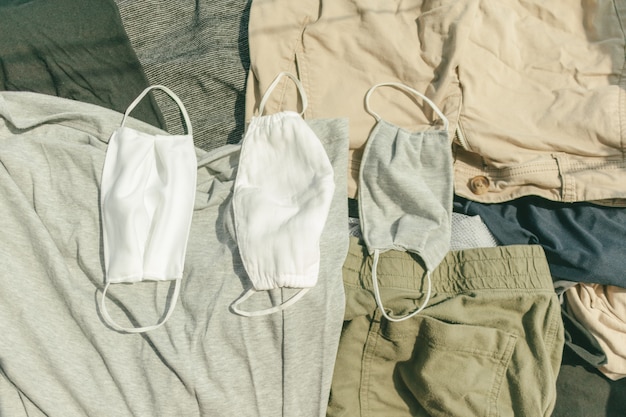 Hygienic mask and clothes being dried on hot sun to kill virus.