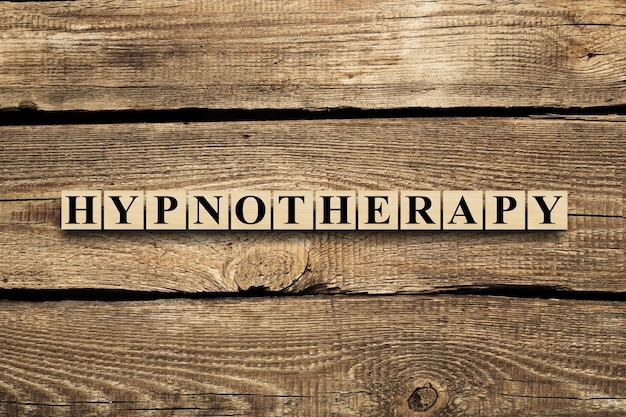 Hypnotherapy word from wooden blocks with letters