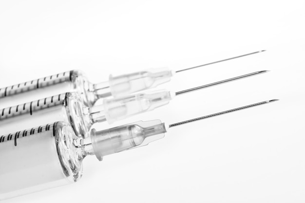 Hypodermic syringe on white background