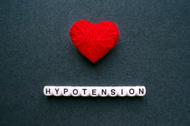 Photo hypotension - low blood pressure. word hypotension