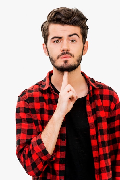 I am fed up. Handsome young man looking at cameraand gesturing handgun while standing against white background
