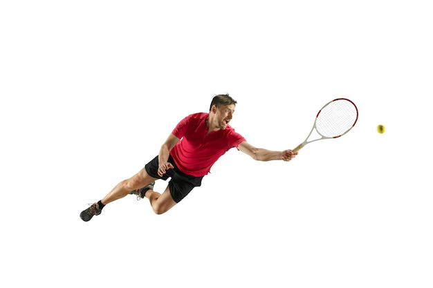 I am saving this ball. Player throw in flight, defense. Jump. Caucasian man playing tennis at studio. Player jumping, isolated on white background in full length with racquet and ball. Emotions, face