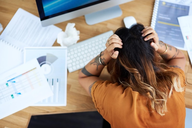 I am way too stressed today Cropped shot of an unrecognizable businesswoman suffering from a headache while in her office during the day