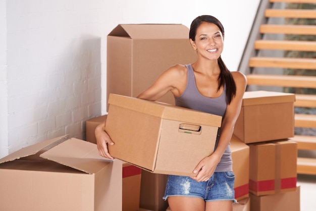 I barely know where to begin Shot of a young woman moving into a new home