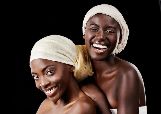 I cant imagine my life without her Studio portrait of two beautiful women wearing headscarves against a black background