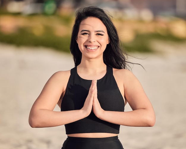 I choose to nourish and blossom within myself Portrait of an attractive young woman meditating at the beach