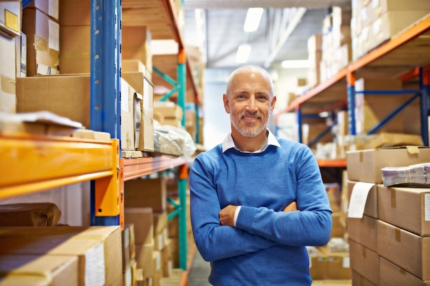 I do a great job and I know it Portrait of a warehouse employee standing beside shelving filled with boxes