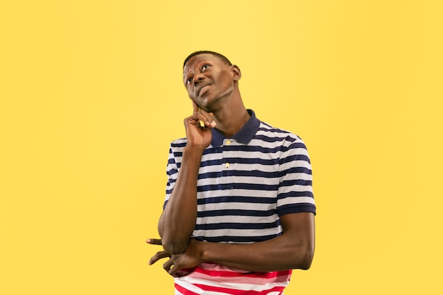 I have a dream Young africanamerican man isolated on yellow studio background facial