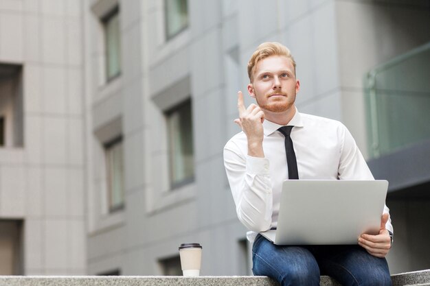 I have idea handsome ginger businessman with beard looking up and finger up