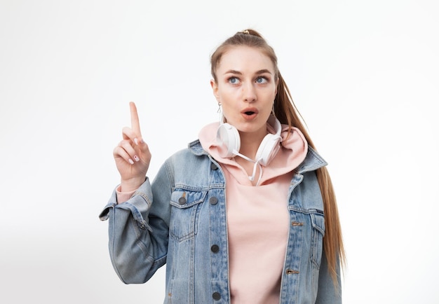 I have an idea Young caucasian woman showing thumb up on white background