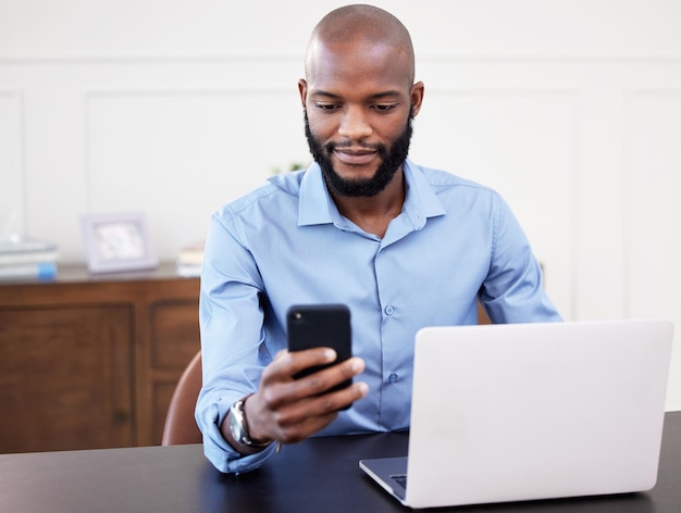 I have an important meeting coming up Shot of a young businessman using his cellphone while sitting at his desk