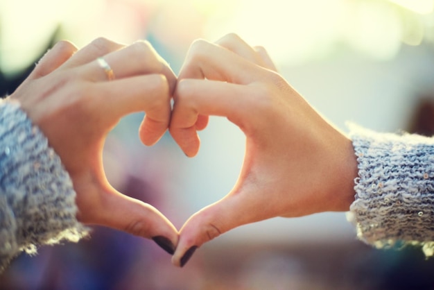 I heart you A young womans hands making a heart shape