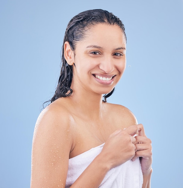 I just got out of the shower Shot of a woman holding a towel around her after washing