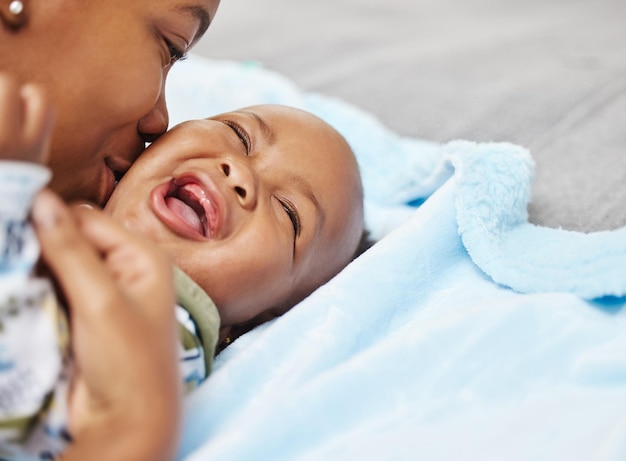 Photo i know im the favourite parent dont tell dad shot of a woman bonding with her baby at home