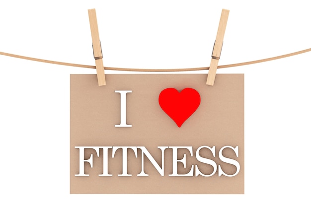 Photo i love fitness with heart hanging with clothespins on a white background